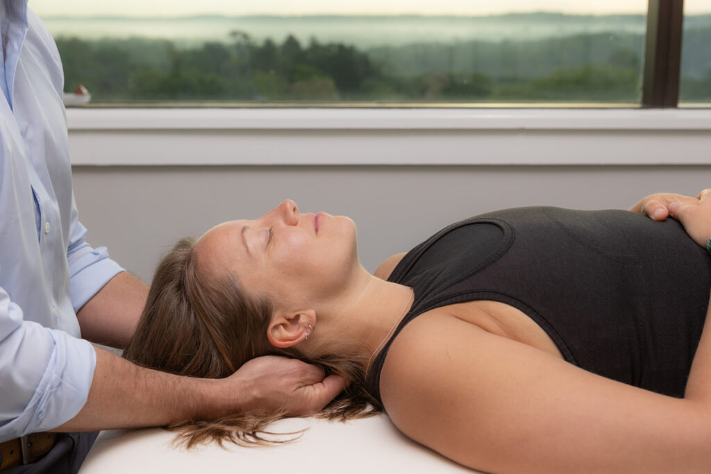 Female patient receiving manual therapy on neck